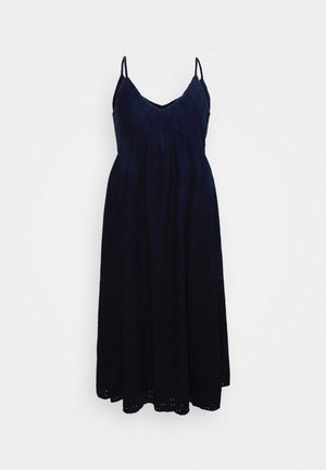 Vestido maxi azul-marinho com alças finas, decote em V e um tecido texturizado com padrões recortados, silhueta fluida e comprimento até o tornozelo.