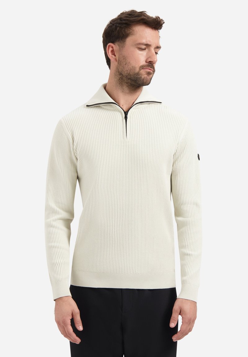Lichtcrème geribbelde pullover met een half-rits kraag, lange mouwen en een zwarte accent op de linkermouw. Zachte textuur en aansluitend ontwerp.