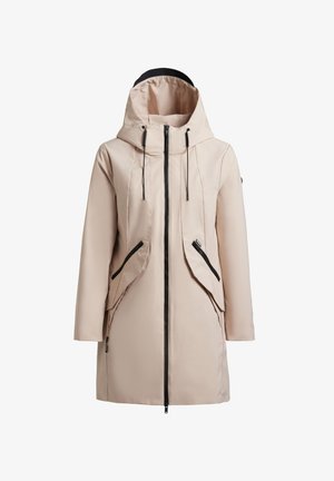 Beige langer Kapuzenmantel mit schwarzem Reißverschluss, verstellbaren Kordeln und schräg verlaufenden Reißverschlusstaschen an den Vorderseiten.