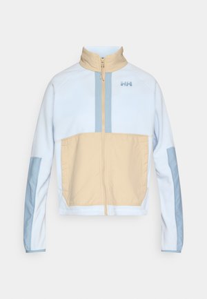 Chaqueta con bloques de color en azul claro y beige. Presenta un cuello alto, cierre frontal de cremallera y mangas en contraste. Tejido suave con textura lisa.