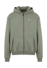 Green zip-up hoodie made of soft fabric, featuring a front pocket, ribbed cuffs, and a simple logo in white on the left side.