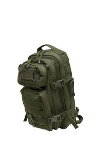 Olive green tactical backpack with multiple zippered compartments, padded straps, and reinforced handle, featuring a textured front patch.