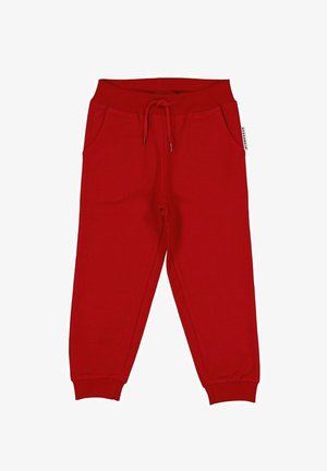 Røde joggingbukser lavet af blødt stof, med elastisk taljebånd med snøre, sidelommer og tilspidsede manchetter.