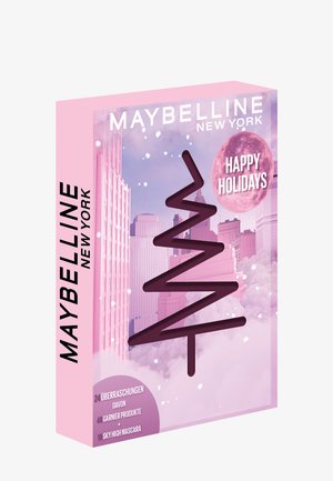 La boîte cadeau de vacances Maybelline New York en rose présente un design en zigzag, le texte "Joyeuses Fêtes" et liste 24 surprises, y compris du mascara.