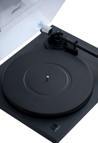 Black turntable with a matte finish, circular platter, central spindle, and a clear plastic dust cover. Features a minimalistic design.