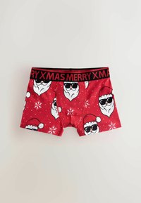Red boxer shorts with a Santa face and sunglasses pattern, featuring white snowflakes. Black elastic waistband with "MERRY XMAS" text.