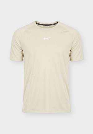 Nike Performance, STRIDE - T-shirt con stampa - cream/sail