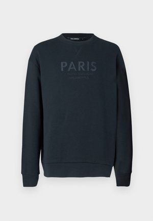 Dark navy sweatshirt made of soft cotton, featuring a round neckline, long sleeves, and embossed text saying "PARIS" on the front.