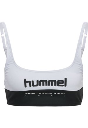 Sports-bh i hvid og sort. Fremstillet af strækbart stof med justerbare stropper. Har et fremtrædende "hummel" logo og tekst på elastikken.