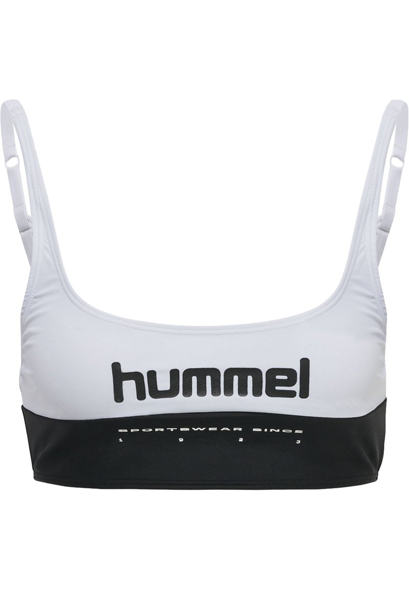 Sportbh i vitt och svart. Tillverkad av sträckbart material med justerbara band. Har en framträdande "hummel"-logotyp och text på bandet.