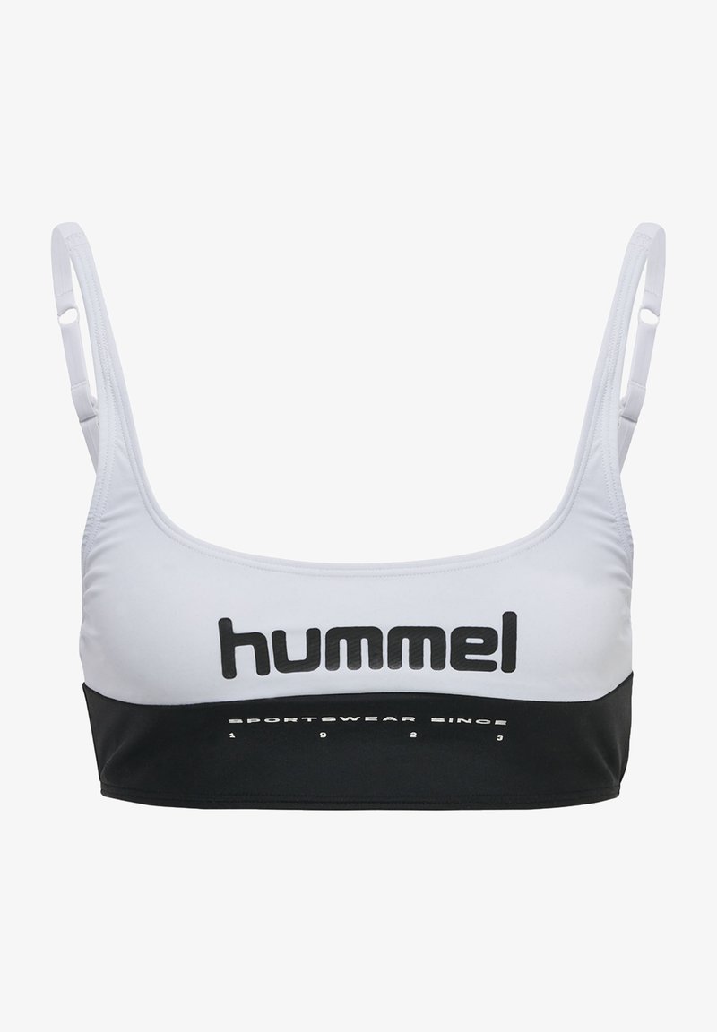 Sportbh i vitt och svart. Tillverkad av sträckbart material med justerbara band. Har en framträdande "hummel"-logotyp och text på bandet.