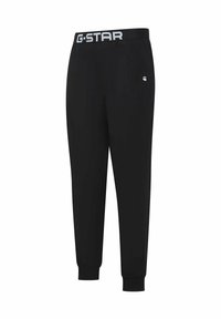 Zwarte G-Star joggingbroeken met een elastische tailleband en een grijs logo. Strak bij de enkel met een gladde stofstructuur.