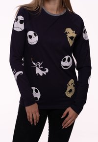 Dark blue long-sleeve shirt with graphic prints of skulls and ghost characters in white and yellow. Features a grey crew neckline.