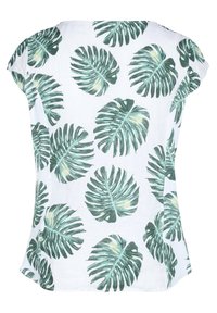 Blouse blanche à manches courtes avec motif de feuilles tropicales vertes de monstera, coupe ample et col rond.