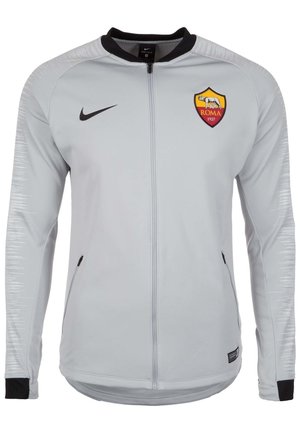Hellgraue Nike Zip-up Jacke mit schwarzem Kragen und Bündchen, AS Roma Fußballclub-Logo auf der linken Brust und schwarzer Nike-Swoosh auf der rechten Brust.