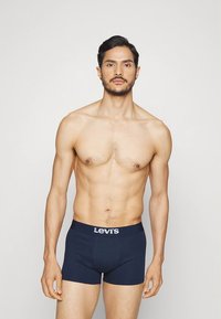 Levi's donkerblauwe boxershorts met een logo-elastiek, gemaakt van zachte stretchstof, met een aansluitend ontwerp en een minimalistische stijl.