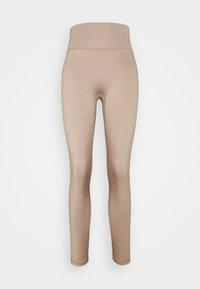 Leggings beige chiaro con una vita elastica spessa, texture liscia, design aderente e senza motivi o dettagli visibili.