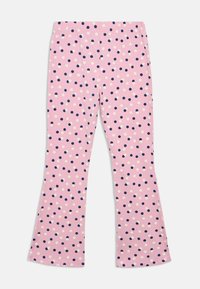 Ροζ κολάν σε φαρδιά γραμμή με μαλακή υφή, που διαθέτει μοτίβο με ποικίλα μεγέθη ναυτικού μπλε και άσπρες βούλες, ομοιόμορφα κατανεμημένες σε όλο το ύφασμα.