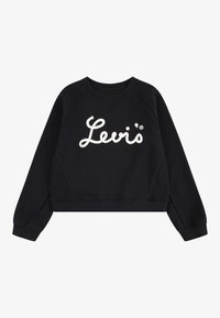 Felpa nera cropped con colletto tondo e maniche raglan, caratterizzata da un grande logo bianco ricamato "Levi's" sul davanti. Texture morbida.