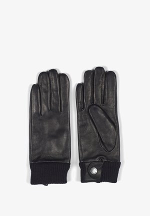 Zwarte lederen handschoenen met vijf vingers, ribbelige zwarte gebreide manchetten en een drukknoopdetail bij de pols. Glad leren oppervlak.