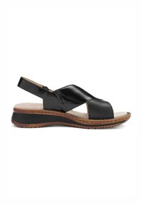 Black leather sandal with cross-strap design, open toe, cushioned footbed, and a thick, textured brown sole for added grip and comfort.