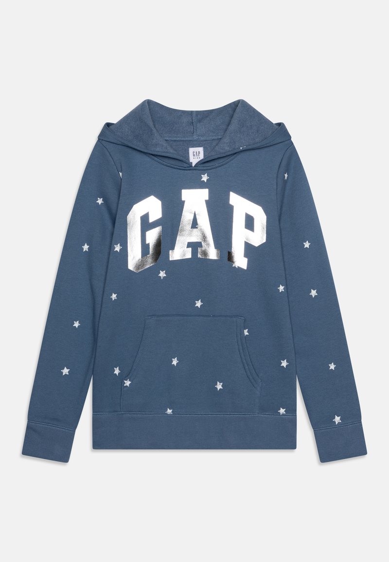 Felpa blu realizzata in morbido tessuto, con grande logo argentato "GAP" e motivi a stelle bianche. Include una tasca frontale e cappuccio.