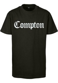 Svart bomull t-skjorte med hvit gotisk stil tekst som leser "Compton" over brystet. Normal passform med korte ermer.