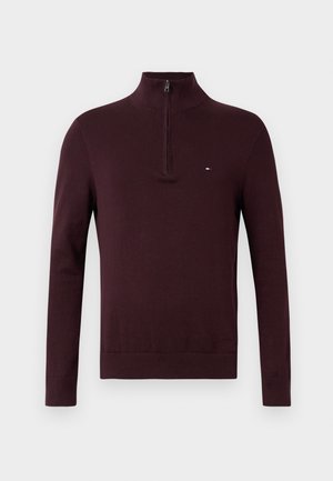 Burgunderfarbener Pullover mit halbem Reißverschluss, langen Ärmeln, gerippten Bündchen und einem kleinen gestickten Logo auf der Brust. Weiches Material.