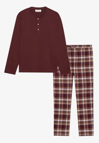 Burgundy långärmad henley-top med tre knappar tillsammans med rutiga pyjamasbyxor i burgundy, beige och vit. Mjuk tygkänsla.