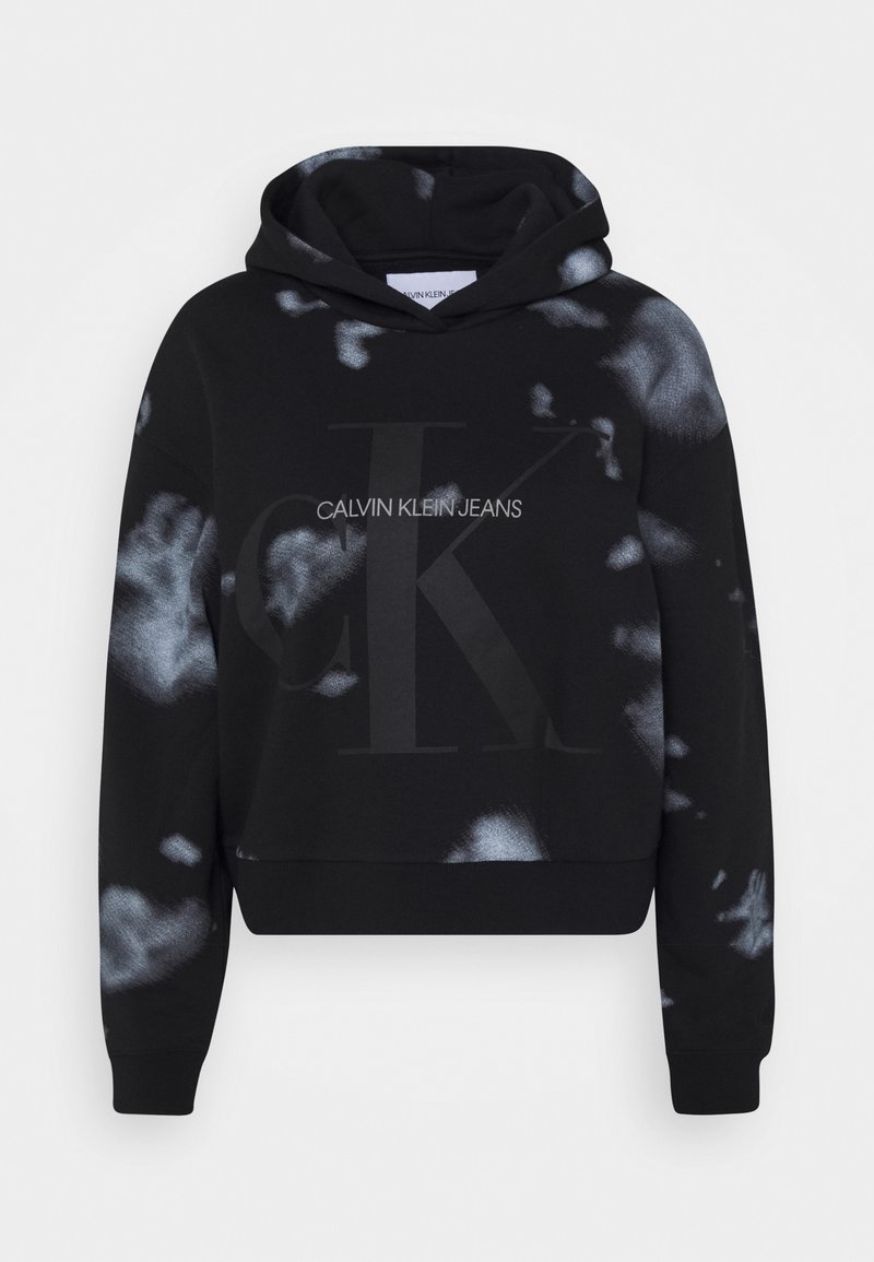 Black cropped hoodie with gray tie-dye patterns, featuring the “CALVIN KLEIN JEANS” logo and a large “CK” design in matte black.