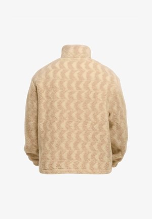 Jachetă din fleece bej cu un model în valuri, guler înalt și croi lejer. Suprafață texturată cu material moale, potrivită pentru purtare casual.