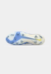 Blue soccer cleat with a textured upper, rubber studs for traction, and a yellow Nike logo. The outsole features a translucent design.