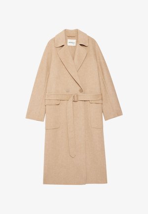 Beige visgraatjas met een geknipt kraag, dubbele knoopsluiting aan de voorkant, riem in de taille en twee voorkruim pockets. Gemaakt van een gestructureerde stof.