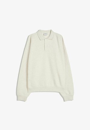 Ljust beige långärmad polo t-shirt i mjukt tyg, med krage, tre knappar samt ribbade ärmslut och fåll.