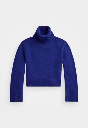 Strikket turtleneck sweater i dyb blå, med ribbet tekstur, tætsiddende lange ærmer og kort længde med ribbede manchetter og kant.
