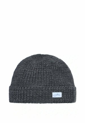 Dark gray knitted beanie with folded edge and a small white fabric tag featuring a signature-style logo on the front.