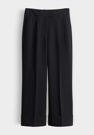 Black wide-leg trousers with a smooth texture, featuring a flat front, two side pockets, and rolled cuffs.