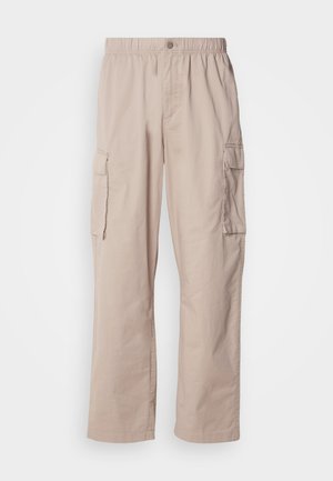 Beige cargo pants with a relaxed fit, elastic waistband, button closure, and side pockets. Made of lightweight fabric with a smooth texture.