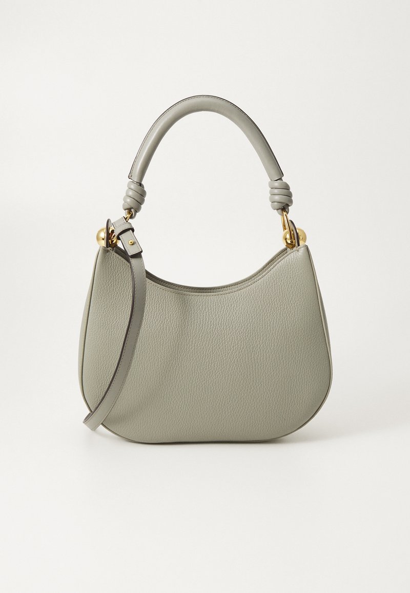 Roheline nahast käekott, millel on sile pind, kaarjas kuju, ülemine sang ja kullatooni detailid. Kaasas on reguleeritav õlarihm.