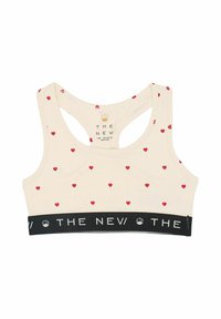 Bustier sport bej cu imprimeuri mici în formă de inimă roșie, având un design cu spate racer și un bandou negru cu text alb "THE NEW". Material moale din bumbac.