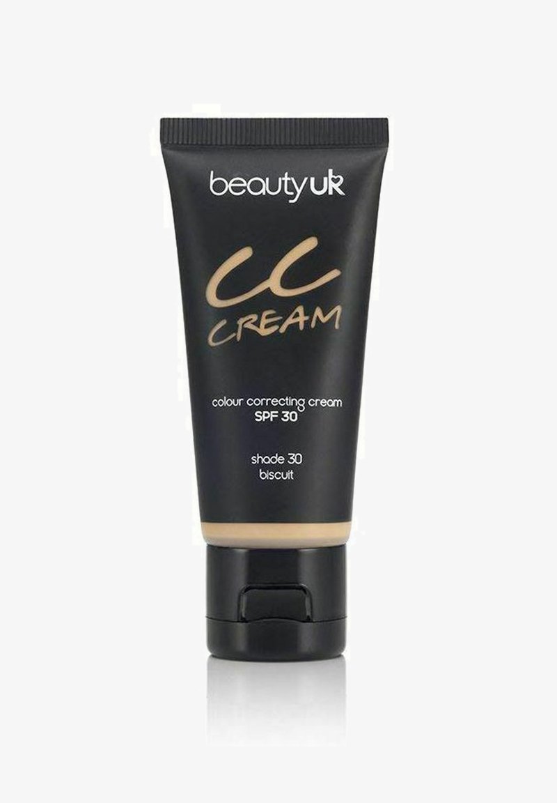 Musta puristustuubi CC-kermaa, jossa on kultaisia yksityiskohtia, sävy 30 "biscuit" ja SPF 30. Täydellinen teksturoitu korkki.