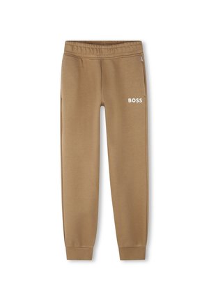 Pantaloni della tuta marroni realizzati in tessuto morbido, con cintura elastica e polsini, e logo "BOSS" in bianco sulla gamba sinistra.