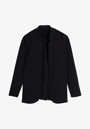 Chaqueta negra de manga larga con textura suave y abertura frontal. Presenta bordes redondeados y un diseño minimalista, fabricada con una tela suave y elástica.