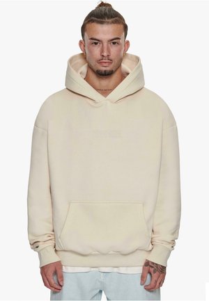Cream-colored hooded sweatshirt with a front pocket, relaxed fit, and ribbed cuffs. Features embossed "DROPSIZE" logo on the chest.