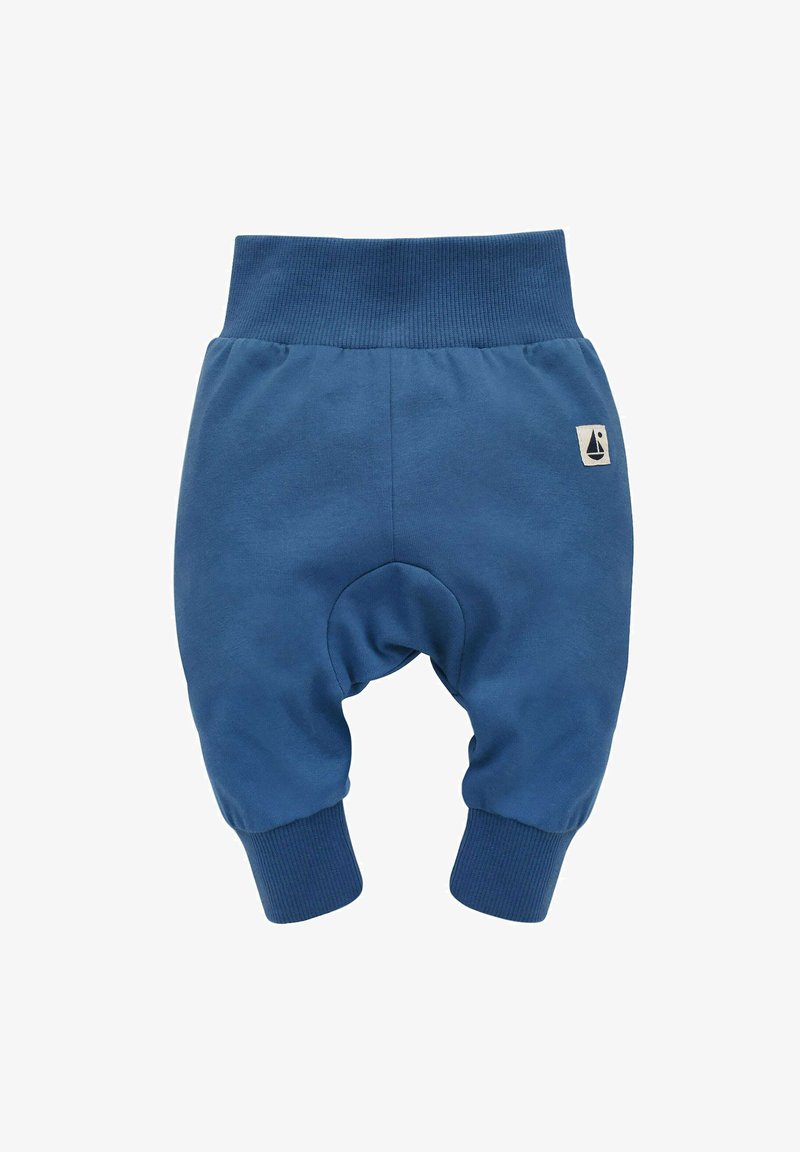 Niebieskie bawełniane spodnie dziecięce z żebrowanym paskiem w talii i mankietami, z okrągłym designem kolan i małą naszywką z logo żaglówki.