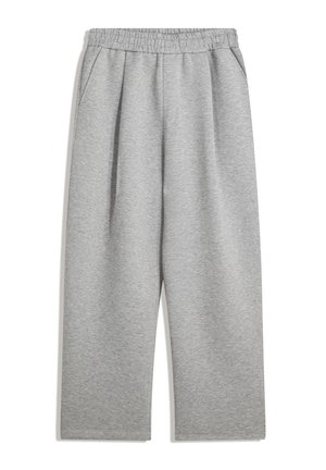 Grijze joggingbroek van zachte stof. Heeft een elastische tailleband en zijzakken. Loze, wijde pasvorm met plooien aan de voorkant.