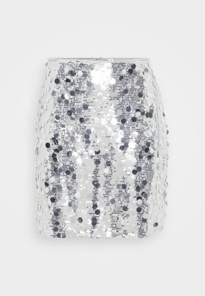 Hõbedane sädelev mini seelik, millel on vormiv siluett ja sile tekstuur, peal siledad ümmargused sädelevad sequins.