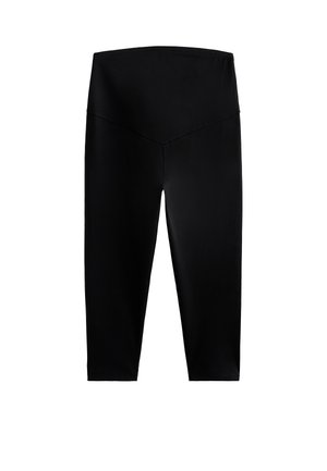 Leggings noirs longueur cheville en tissu extensible, dotés d'une taille haute et large, avec une finition lisse et mate. Sans motifs ni accents.