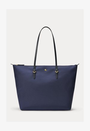 Sac cabas bleu marine avec anses en cuir noir, quincaillerie dorée et petit logo doré centré sous la fermeture éclair.
