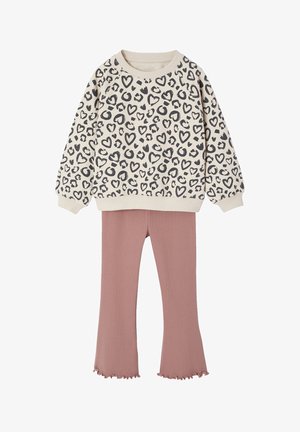 Cream sweatshirt with black heart and leopard prints paired with dusty pink flared pants with ruffled hems for kids.